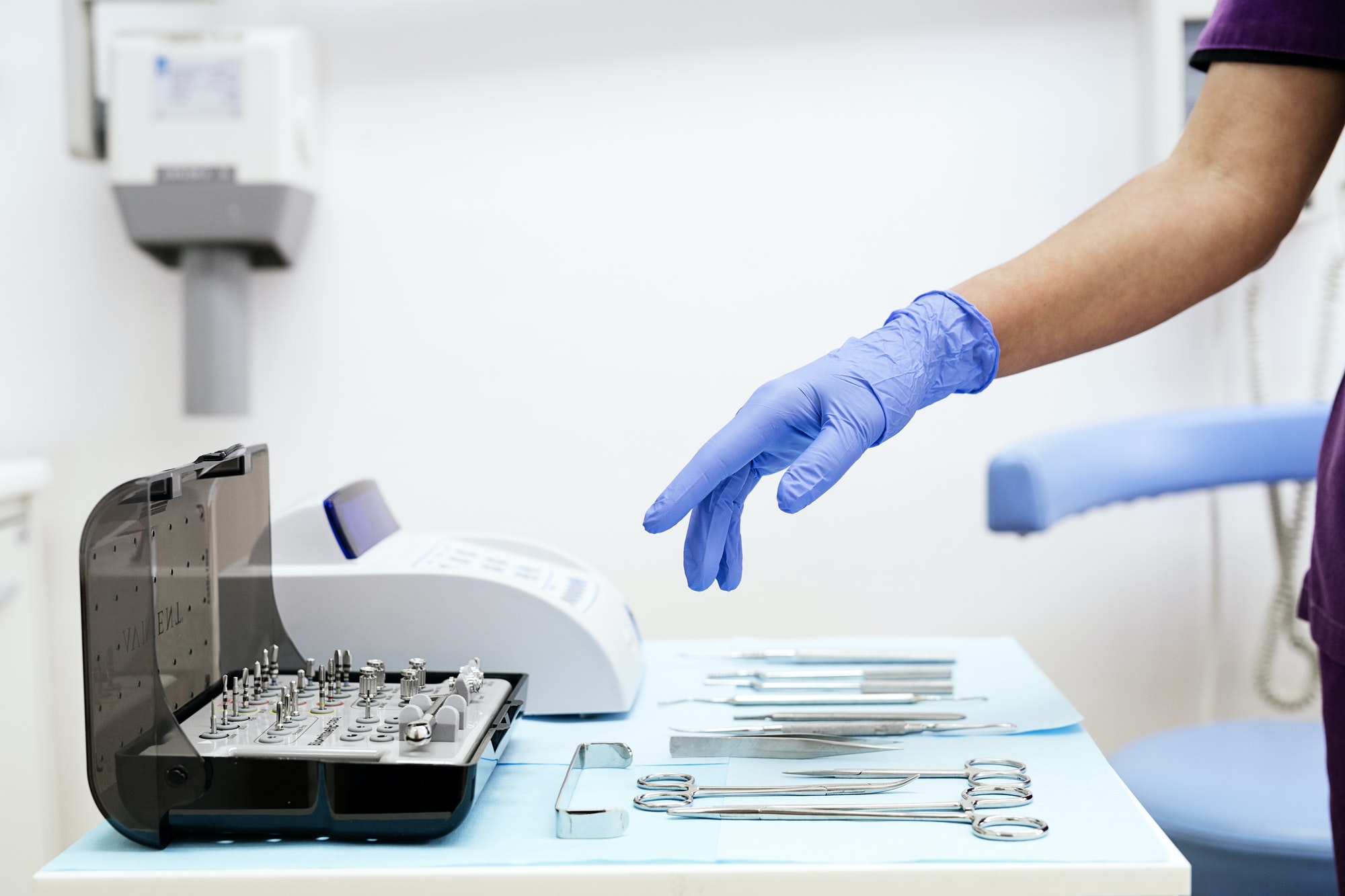 detail of hand holding dental tools in dental clinic 1 1